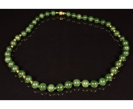 A beaded nephrite jade necklace with 18ct gold clasp and beads