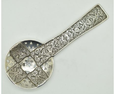 Amy Sandheim Arts &amp; Crafts Celtic style hallmarked silver sifter spoon, London 1924, length 13cm, weight 39g
