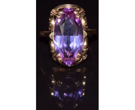 A 14k gold ring set with a synthetic purple sapphire, 8.8g, size Q