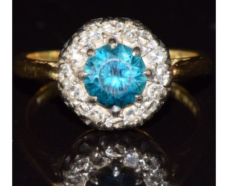 An 18ct gold ring set with a zircon surrounded by diamonds, 4.0g, size J