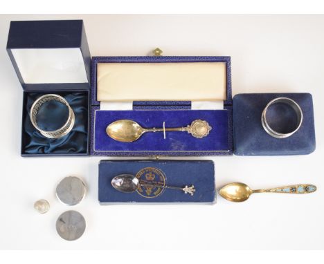 Two cased hallmarked silver napkin rings, two cased hallmarked silver spoons, Russian silver gilt and enamel spoon, hallmarke