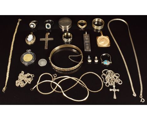 A collection of silver jewellery including bangle, five rings, chains, pendants, horse pendant and coin pendant