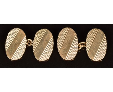 A pair of 9ct gold oval cufflinks with engine turned decoration, 5.2g