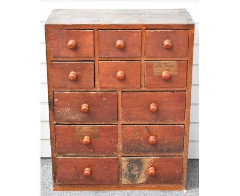 Victorian stained pine haberdashery chest of 12 drawers containing pocket watches, tools, watch and clock parts, music box mo