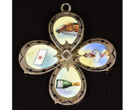 Art Deco silver charm in the form of a horse's hoof opening into four set with enamel depicting a race horse, champagne, danc