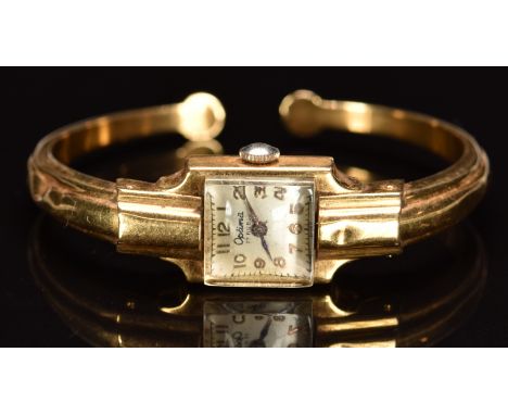 Optima 18ct gold ladies bangle wristwatch with blued hands, gold Arabic numerals, silver dial and 17 jewel movement, case dia