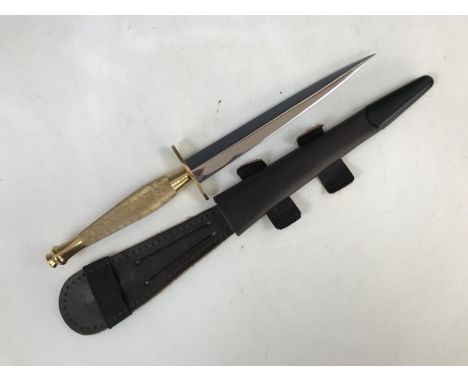 A contemporary British military third pattern FS fighting knife, the cross guard bearing MOD broad arrow mark and manufacture