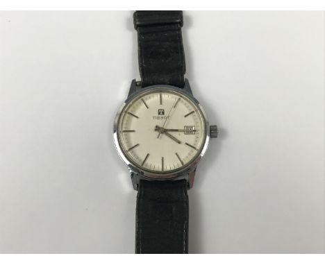 A 1960s-1970s Tissot stainless steel wrist watch, having manual wind movement with brushed silver face, baton markers and dat