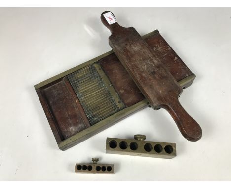 A Victorian mahogany and brass pill roller together with two brass suppository moulds