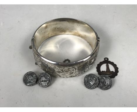 A silver hinged bangle, having foliate engraved decoration, together with a silver pendant and a pair of Scottish cuff links,