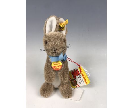A Steiff Manni miniature rabbit, in brown, with original paper tags