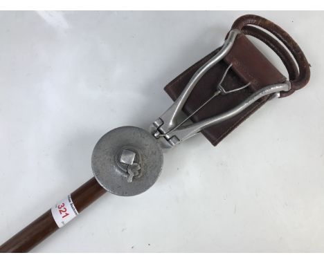 A vintage shooting stick with hardwood shaft and cast duralumin mounts