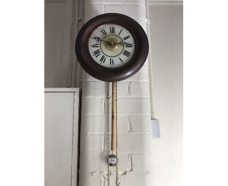 An early 20th Century German 'postman's clock' retailed by Thomas Lovejoy of Wimbledon, having a 30 hour movement with alarm,