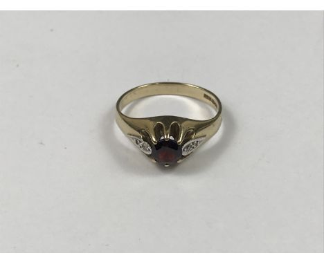 A 9ct gold, garnet and diamond dress ring, having central round-cut garnet flanked by a pair of diamond-set teardrops, 3.2g