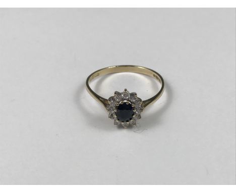 A 9ct gold blue and white stone dress ring, in a flower head cluster arrangement, 1.4g 