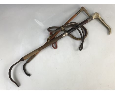 A George V silver-collared and antler-handled driving whip, together with a riding crop