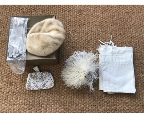 A vintage Fenwick's 'French Salon' hat box containing a quantity of costume accessories and textiles, including an early 20th