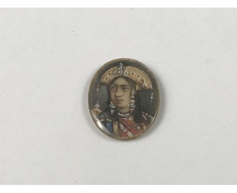A late 19th / early 20th Century hand-painted portrait miniature of a South American wearing an Aztec headdress, painted on p