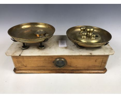 A vintage set of counter-top beam scales with Avery weights etc