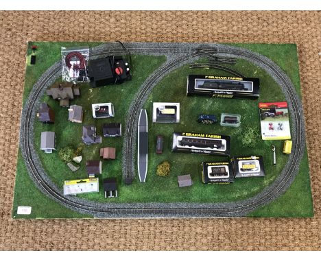 An N-gauge railway layout together with buildings and a Graham Farish V2 60800 Green Arrow locomotive, Graham Farish rolling 