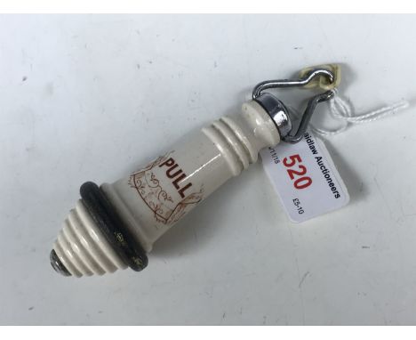 A transfer-printed ceramic lavatory flush pull