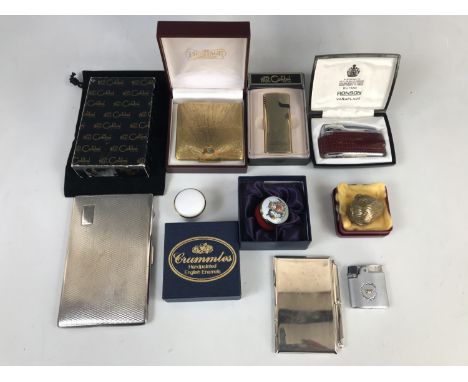 Compacts, trinket boxes and lighters, including a contemporary electroplate aide-memoire, a cigarette box, a Crummels kitten 