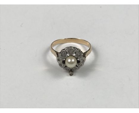 A vintage yellow-metal, pearl and paste dress ring, in an open flower-head arrangement, 1.9g