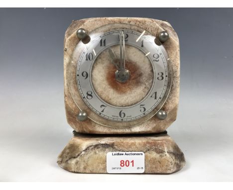 A polished mineral cased&nbsp;electric&nbsp;mantel clock