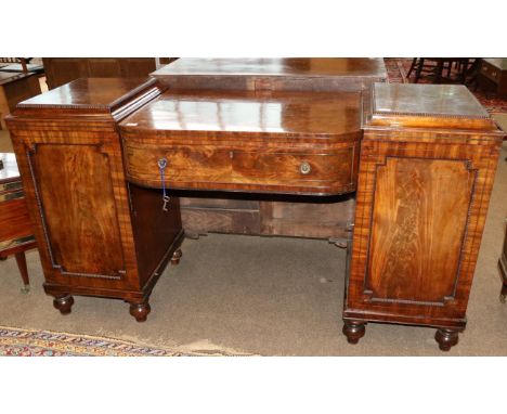 A Regency Mahogany and Brass Strung Pedestal Sideboard, early 19th century, of bowfront form with a long frieze drawer, each 