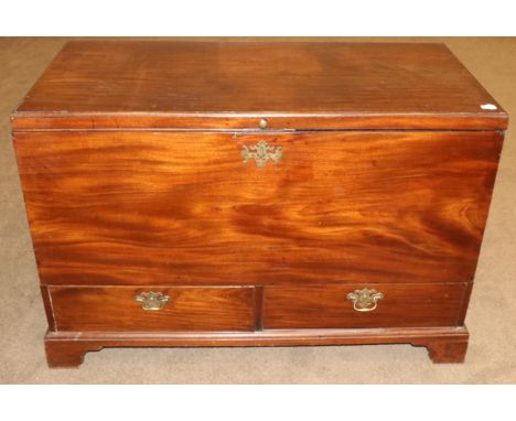 A George III Mahogany Mule Chest, late 18th century, with hinged lid and brass carrying handles, with two deep drawers above 