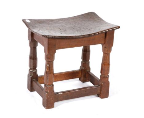 Mouseman: A 1930's Robert Thompson Burr Oak Dish Top Stool, the dense burr oak top, on four octagonal legs, joined by stretch