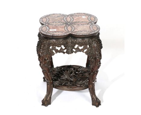 A Chinese Padouk Wood, Pink Marble and Mother-of-Pearl Inlaid Plant Stand, late 19th/early 20th century, with a prunus carved