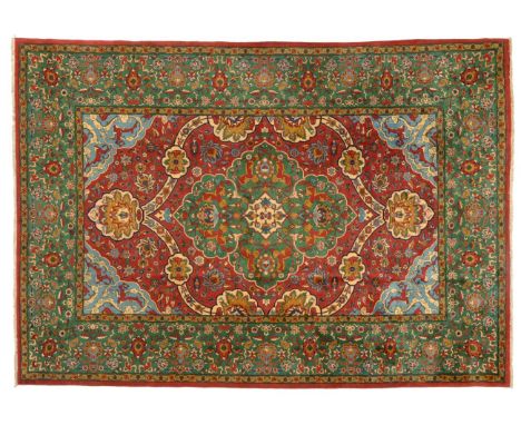 Very Finely Woven Petag Design Carpet, 20th century The raspberry field centred by a cusped apple green medallion enclosed by