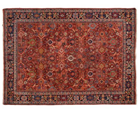 Mahal Carpet West Iran, circa 1930 The blood red field with an allover lattice design of plants and vines enclosed by indigo 