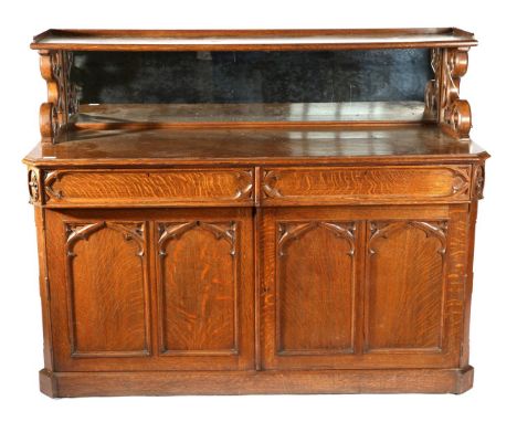 A Victorian Carved Oak Gothic Revival Chiffonier, late 19th century, the superstructure with a shelf supported by quatrefoil 