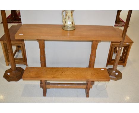 Yorkshire School: An English Oak Side Table, on two octagonal legs joined by a floor stretcher, unmarked, 121.5cm by 38.5cm, 