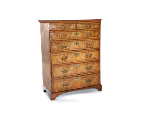 A George II Walnut, Crossbanded and Barber's Pole Strung Straight Front Chest of Drawers, 2nd quarter 18th century, with two 