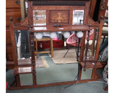 An Edwardian marquetry inlaid overmantle, fitted with bevel mirror plates, 105cm wide