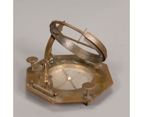 Sundial with compass, octagonal shape, brass, partly engraved with Roman and Arabic numbers; dial with iron finger; collapsib