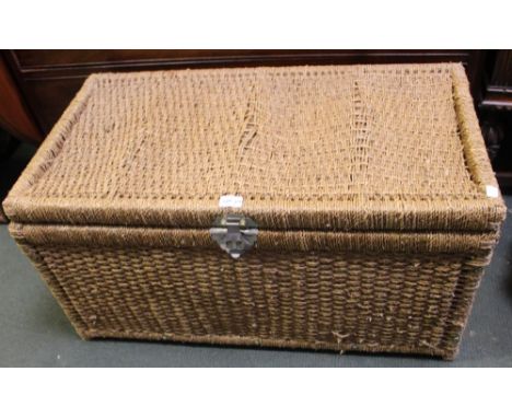 A raffia woven storage trunk
