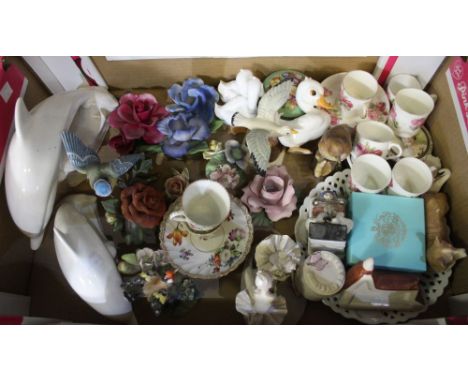 A box of assorted decorative wares, includes two "Poole" dolphins&nbsp;