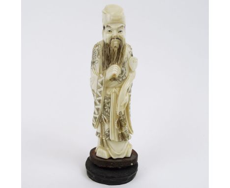 Vintage Carved Chinese Ivory Figure  on hardwood stand of a Man Holding a Ruyi. Unsigned. Measures 7-1/2" overall. Age cracks