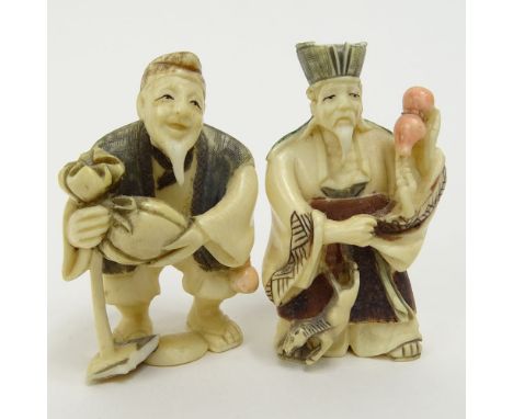 Two Vintage Figural Netsuke. Signed. Small losses. Measures 2". This item will only be shipped domestically and was legally i