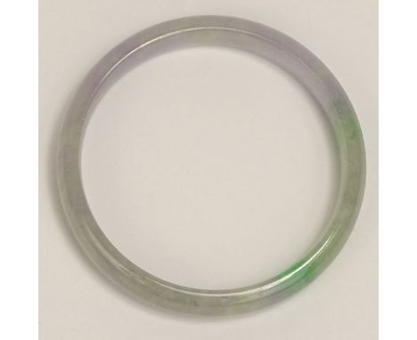 Chinese Lavender to Green Jadeite Bangle Bracelet. Unsigned. Good condition. Measures 1/2" W, 2-1/4" interior diameter. Shipp