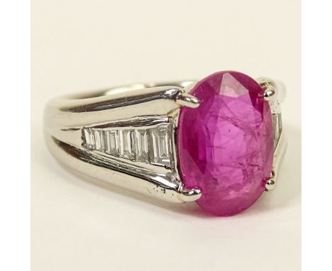 4.92 Carat Oval Cut Burma Ruby, .45 Carat Baguette Cut Diamond and Platinum Ring. Ruby with good saturation of color. Diamond