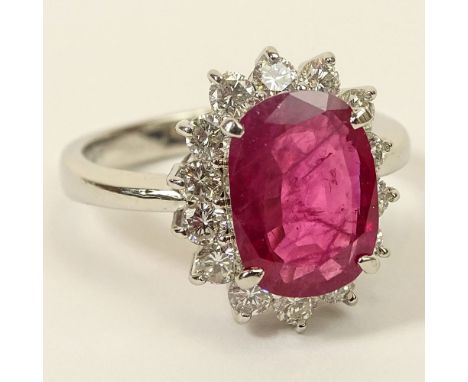 3.12 Carat Oval Cut Ruby, .94 Carat Round Brilliant Cut Diamond and Platinum Ring. Ruby with vivid saturation of color. Diamo