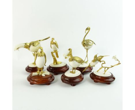 Boxed set of Ivory and 18K Gilt Metal Exotic Bird Figurines. Each bird hand carved and mounted in 18K gold plated metal. Affi