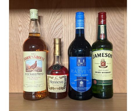 Four bottles of spirits, A Famous Groose scotch whiskey, a Haweys Bristol Cream, a Jamesons and a half bottle of Hennessy V.S