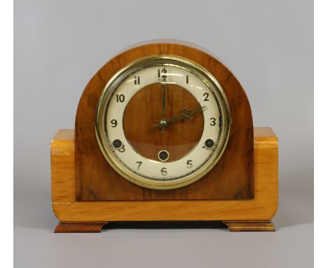 An Art Deco walnut cased eight day Westminster chime mantel clock.