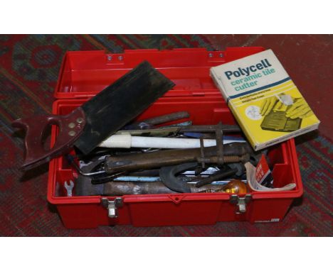 A tool box containing a quantity of household tools, wood saw, G clamp, screwdrivers, tin snips etc.